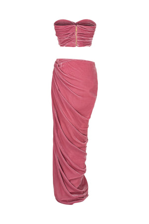 Corseted top paired with a draped skirt