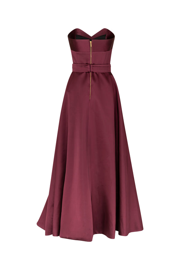 Strapless asymmetrical gown with signature belt